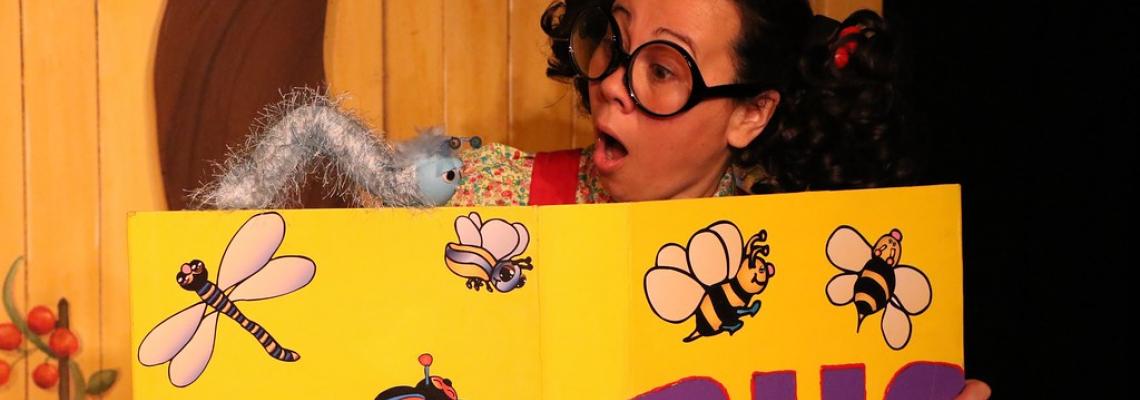 Trudy (actor) with Harold the Caterpillar (puppet) and the Bug Book, Photo Credit: Graham Gardner 